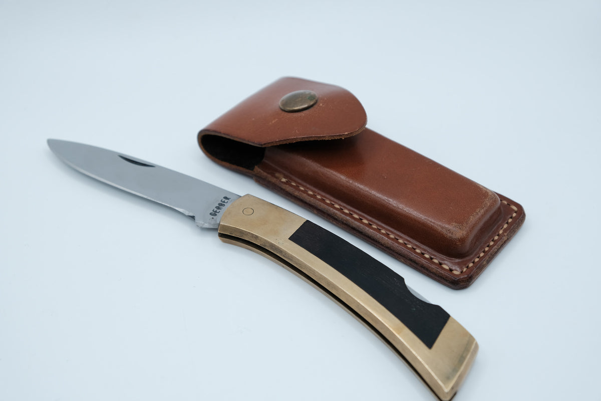 Gerber Portland Sportsman Lockback — Brass Frame, Ebony Inlay, Original Leather Sheath, 1970s–80s USA